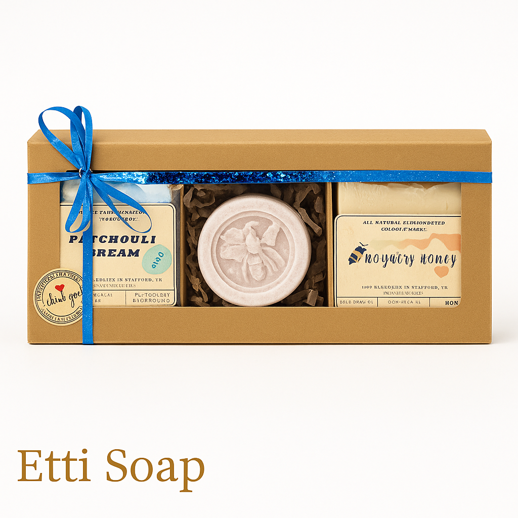 Etti Soap gift box with Patchouli Dream and Royalty Honey soaps and round floral soap, blue ribbon