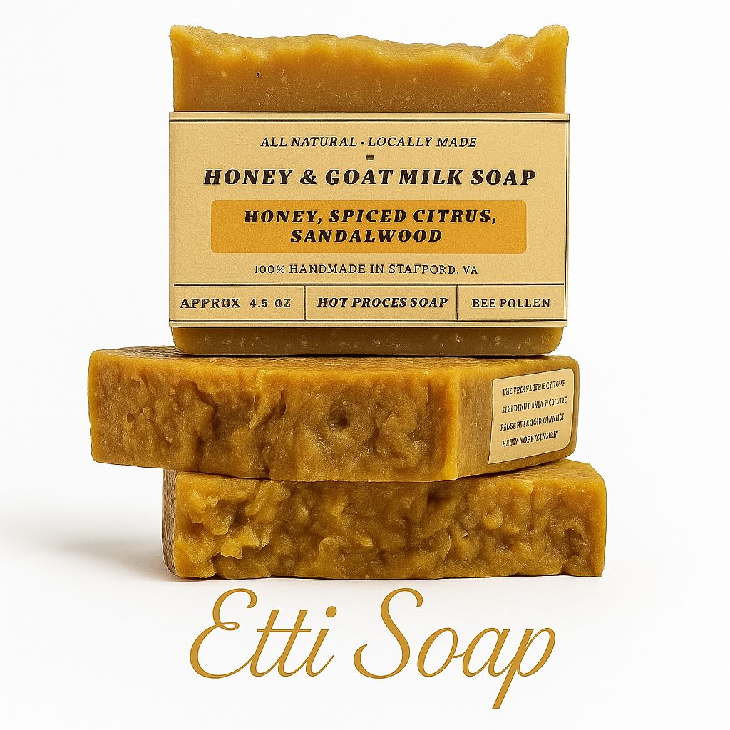 Three bars of honey and goat milk soap with a visible label on a white background, featuring the brand 'Etti Soap'.