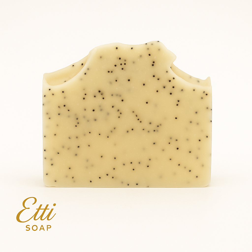 Natural artisan lemon soap bar with aloe vera, kaolin clay, and gentle exfoliating poppy seeds on white background.