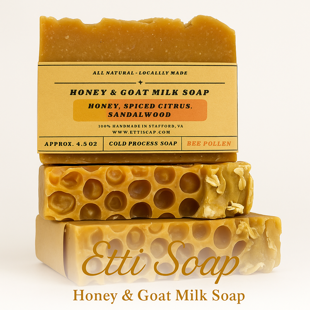 Two bars of honey and goat milk soap with a label on a white background