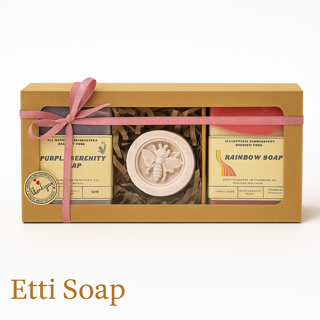 Etti Soap gift box with Purple Serenity and Rainbow soaps and round bee soap, pink ribbon.