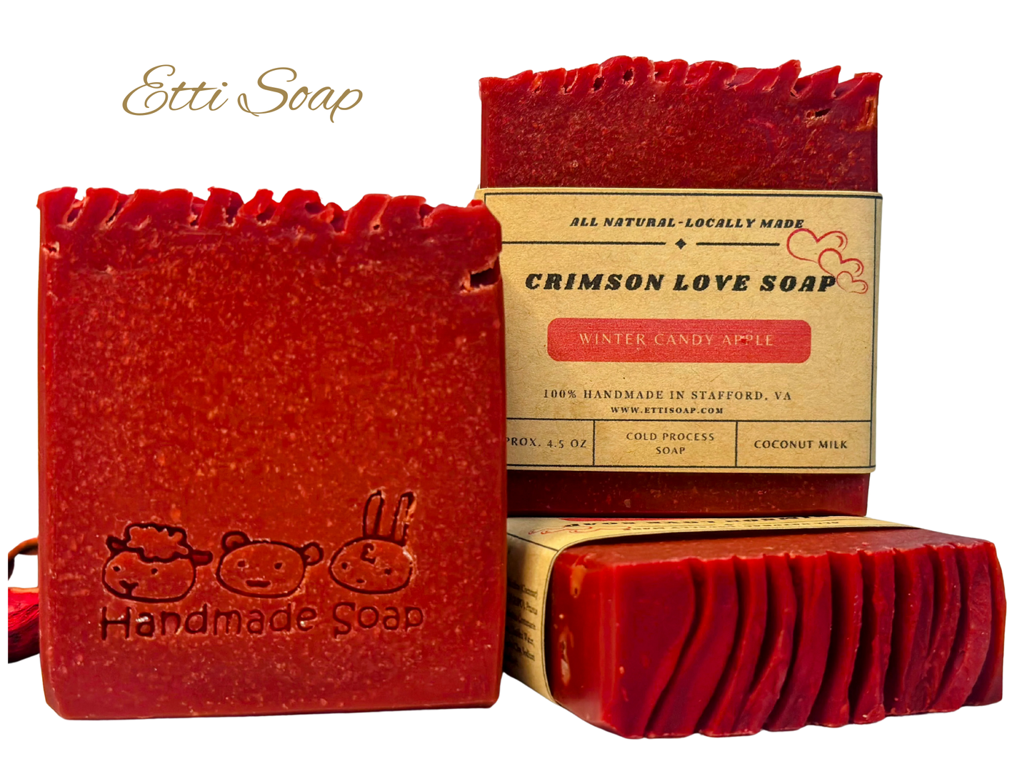 Handmade cold process red artisan soap on a white background, sweet almond oil blend, festive gift-ready.