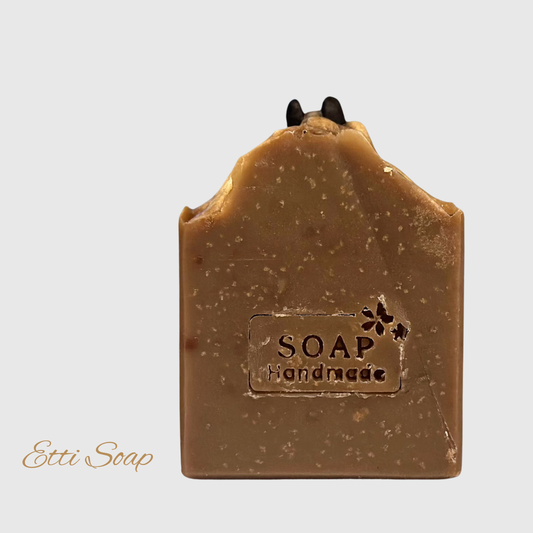 Natural artisan coffee soap with creamy lather and caramel aroma, handcrafted in small batches with eco-friendly oils.