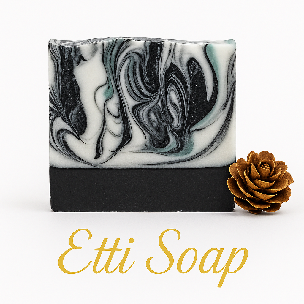 Marbled black and white soap bar with a brown rose on a white background, featuring the brand 'Etti Soap'.