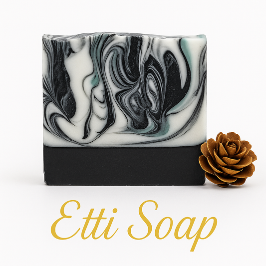 Marbled black and white soap bar with a brown rose on a white background, featuring the brand 'Etti Soap'.