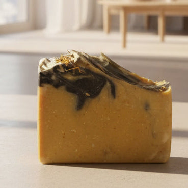 Bar of soap with a marbled design on a white surface