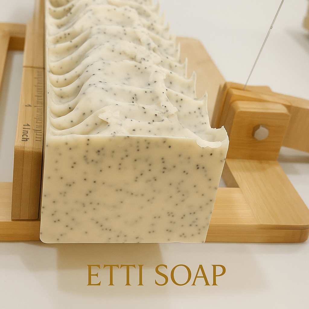 Natural artisan lemon soap bar with aloe vera, kaolin clay, and gentle exfoliating poppy seeds on white background.